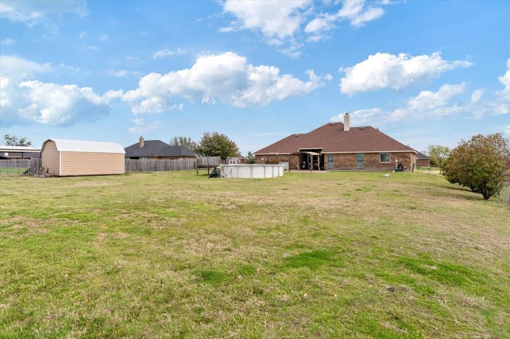 5366 Tree Grace Lane Kaufman, TX 75142 - Photo 28 of 33 a view of a lake with a house in the background