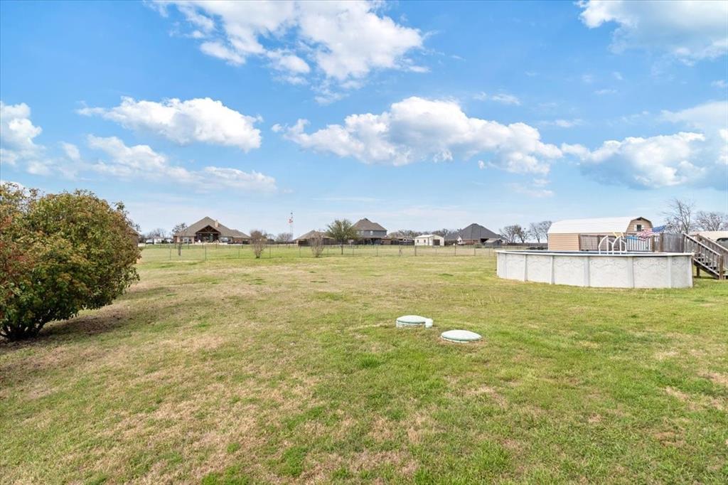 5366 Tree Grace Lane Kaufman, TX 75142 - Photo 29 of 33 a view of a lake with houses in the back