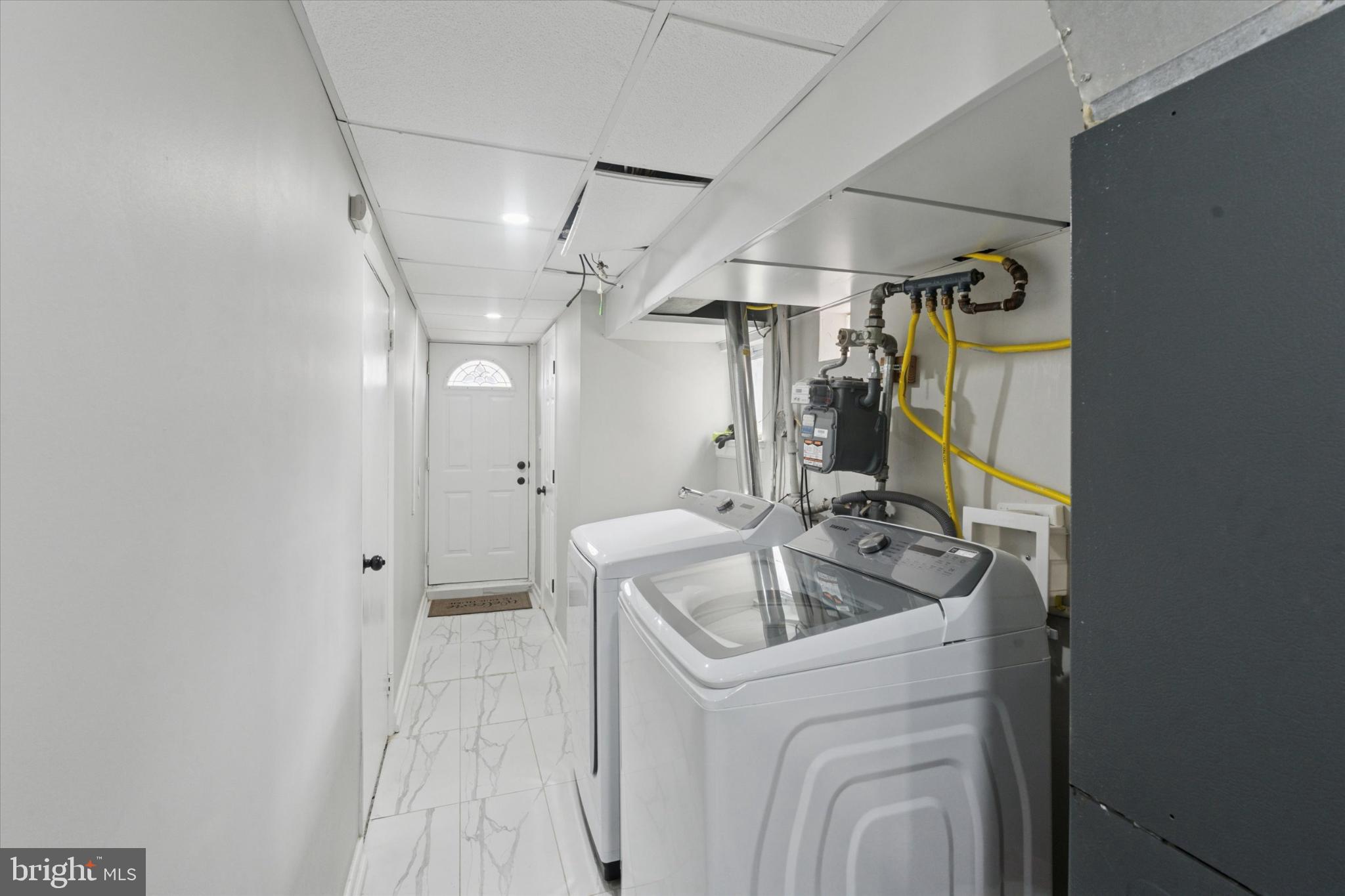 9938 Alicia Street Philadelphia, PA 19115 - Photo 14 of 15 a bathroom with a sink a toilet and shower