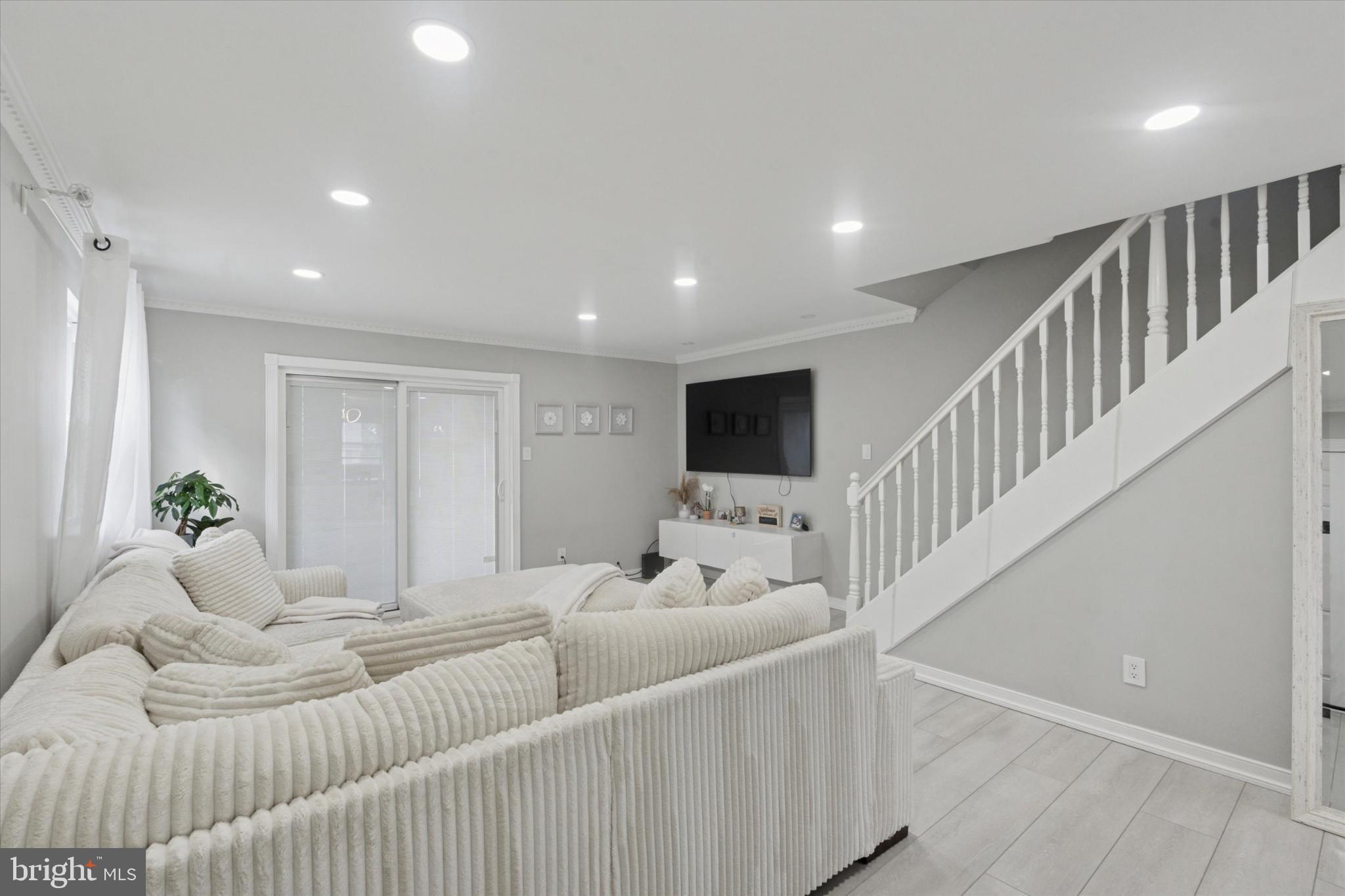 9938 Alicia Street Philadelphia, PA 19115 - Photo 2 of 15 a living room with furniture and a flat screen tv