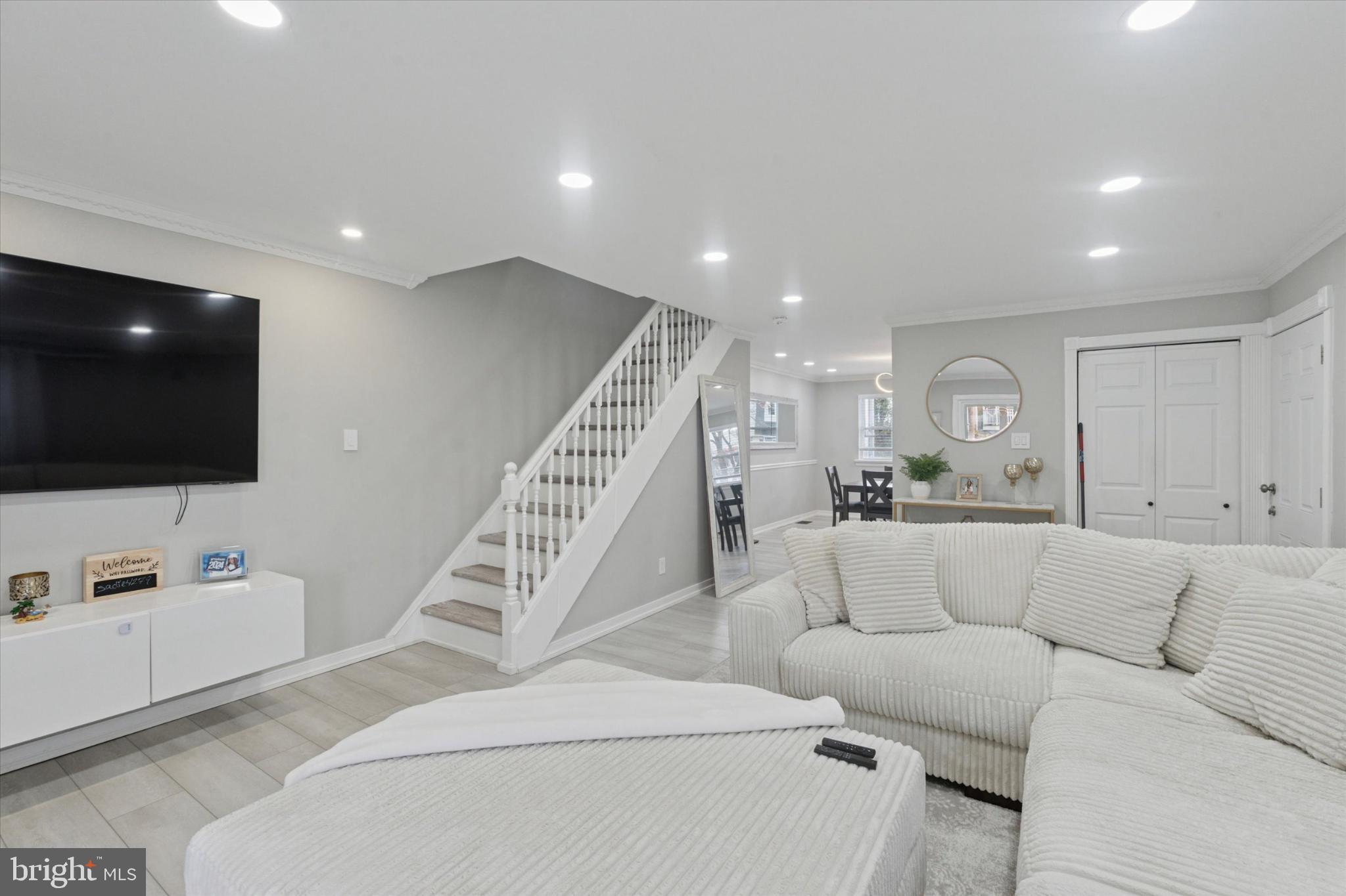 9938 Alicia Street Philadelphia, PA 19115 - Photo 3 of 15 a living room with furniture and a flat screen tv