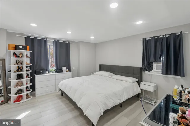 a spacious bedroom with a bed and a walk in closet