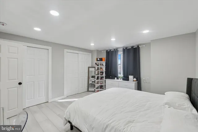 a bed room with a bed and a television