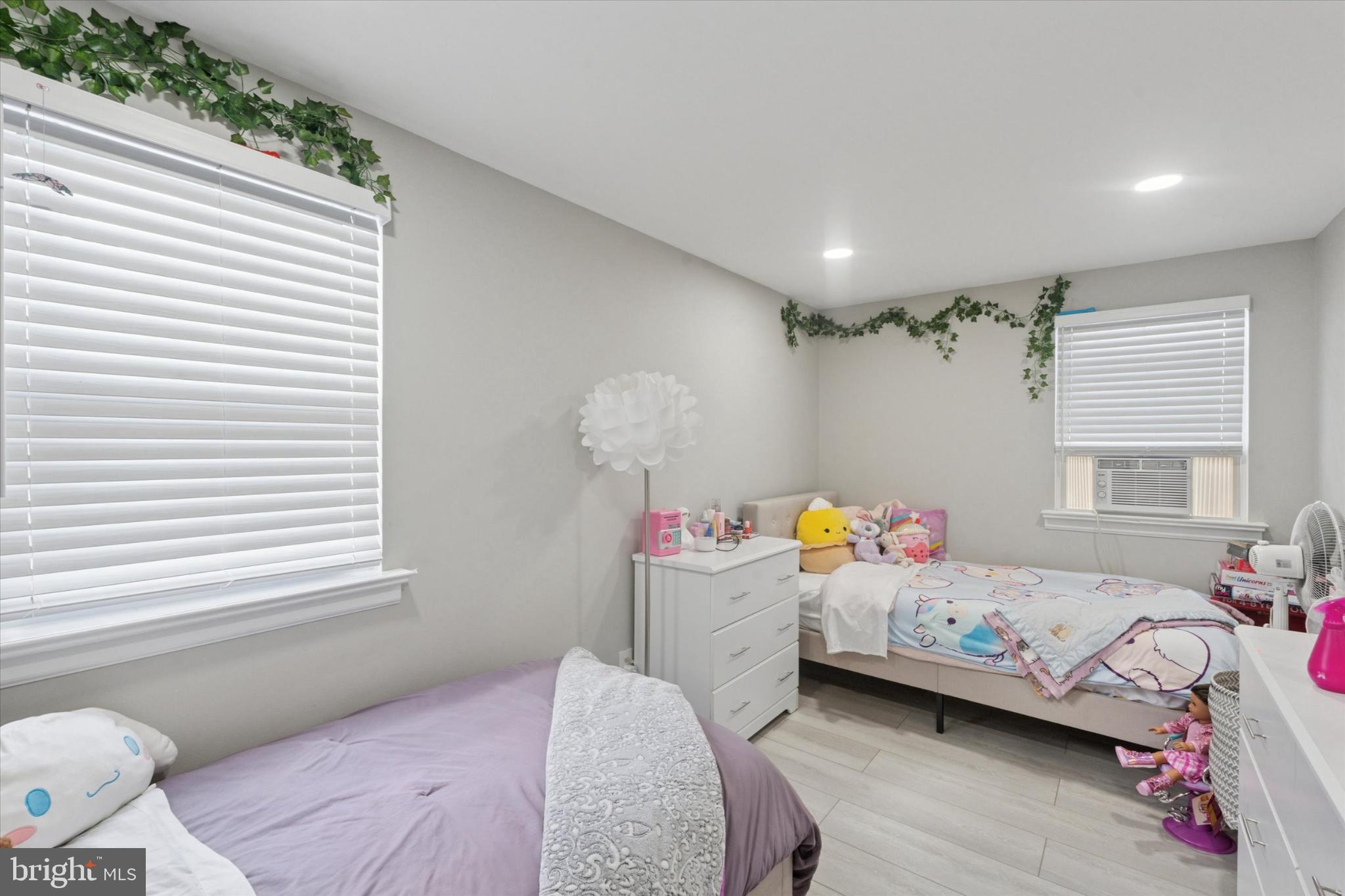 9938 Alicia Street Philadelphia, PA 19115 - Photo 7 of 15 a bedroom with a bed and a window