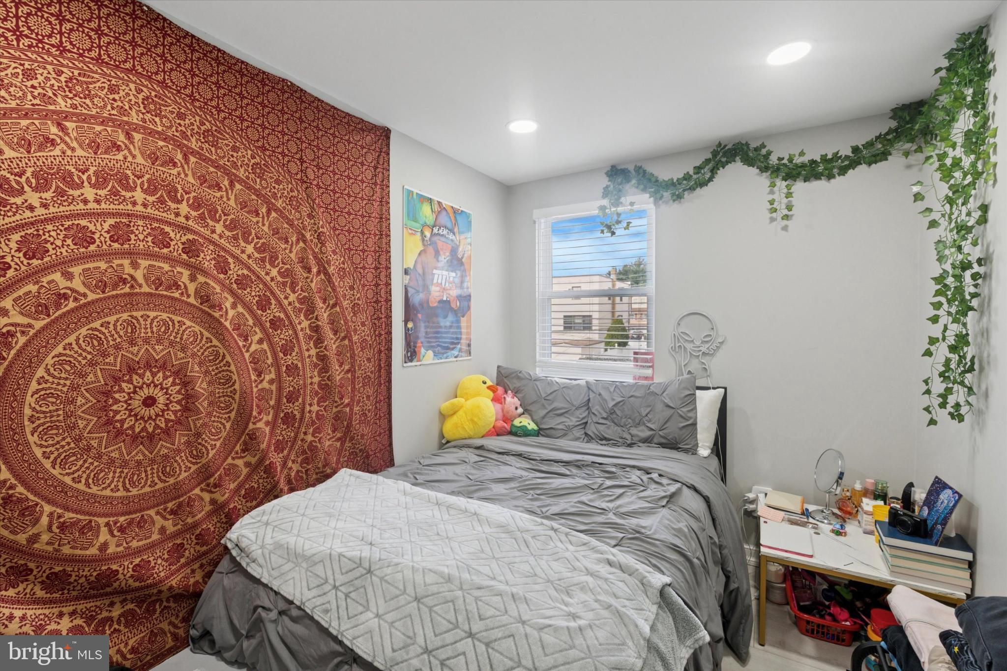 9938 Alicia Street Philadelphia, PA 19115 - Photo 9 of 15 a bedroom with a bed and a window