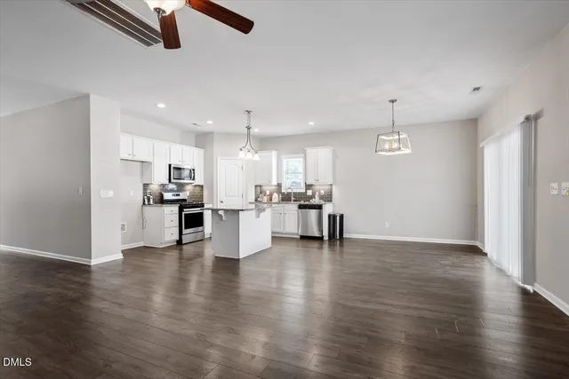 a view of kitchen with furniture and wooden floor