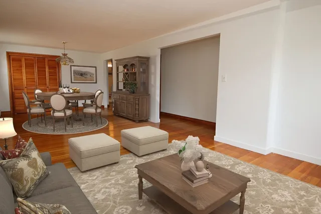 a view of a dining room with furniture and wooden floor