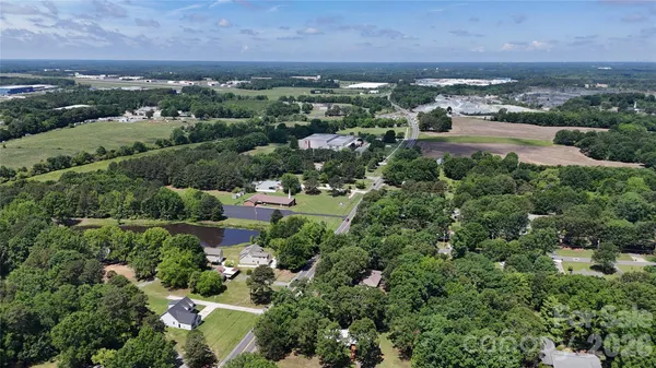 an aerial view of house with yard and mountain view