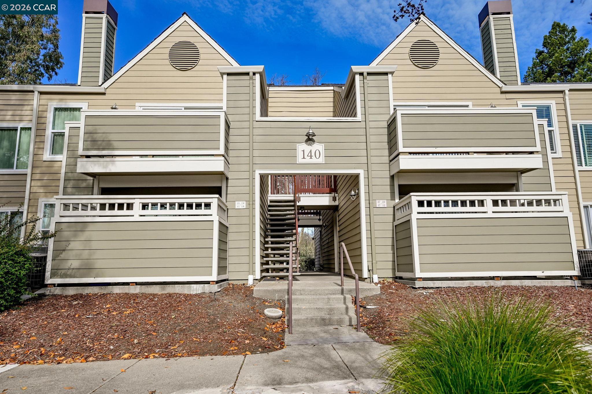 140 Reflections Drive, Unit 21 San Ramon, CA 94583 - Photo 1 of 34 a view of a house with a garage and fireplace