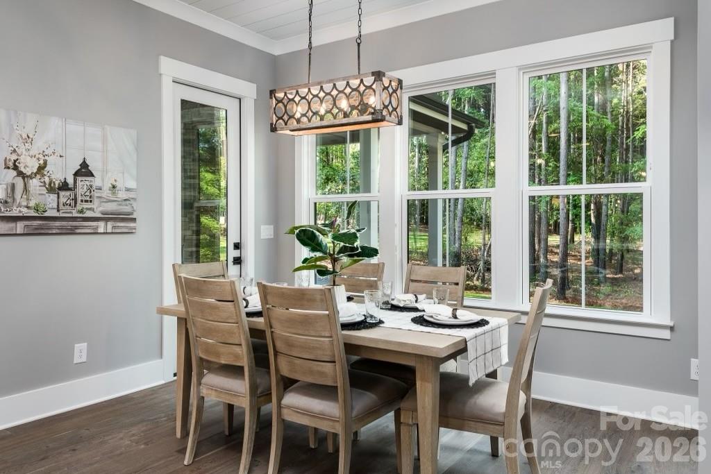 116 Silver Falls Road Troutman, NC 28166 - Photo 22 of 46 a view of a dining room with furniture window and outside view