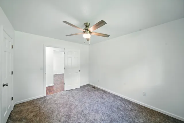 a view of a big room with carpet