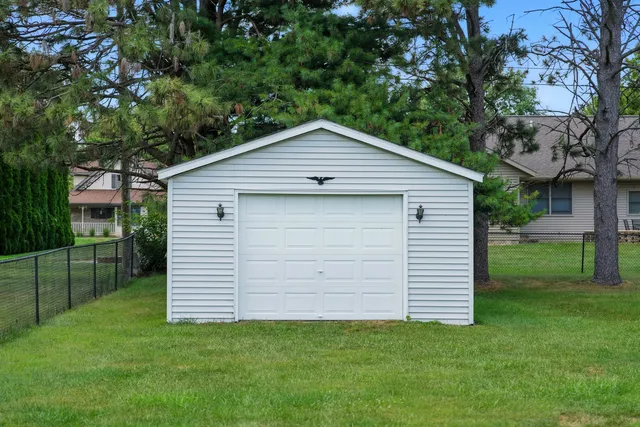a view of a house with a backyard