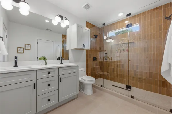 a bedroom with a bed and a wall painting