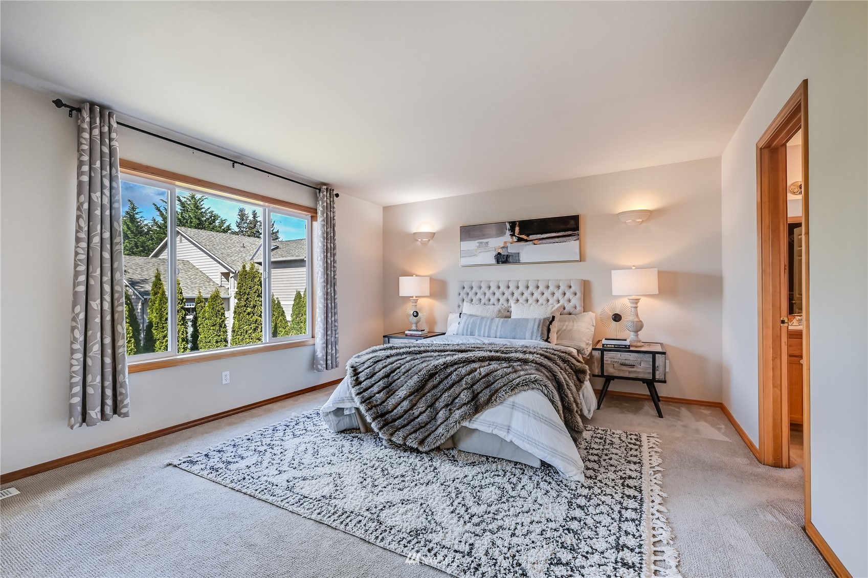 1125 185th Place Southeast Bothell, WA 98012 - Photo 11 of 23 a bedroom with a bed and wooden floor