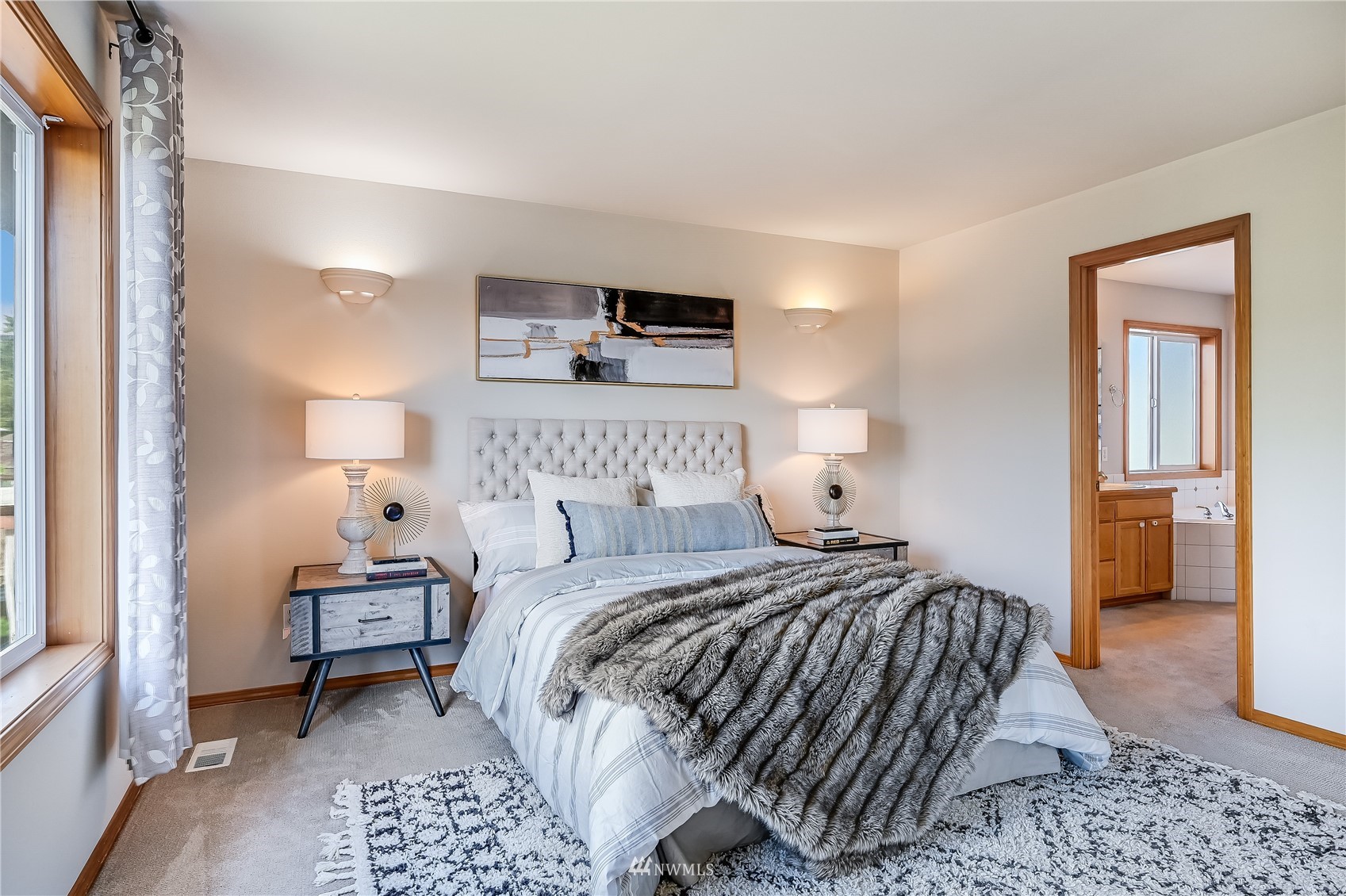 1125 185th Place Southeast Bothell, WA 98012 - Photo 12 of 23 a bedroom with a bed and a lamp
