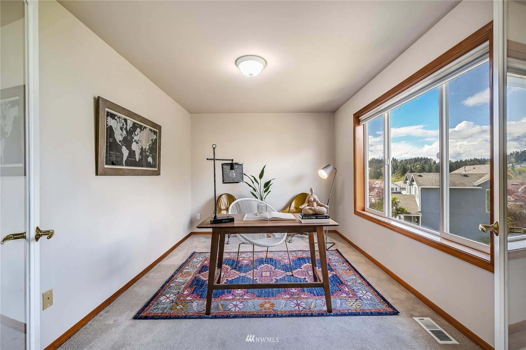 1125 185th Place Southeast Bothell, WA 98012 - Photo 15 of 23 a living room with furniture a rug and a large window