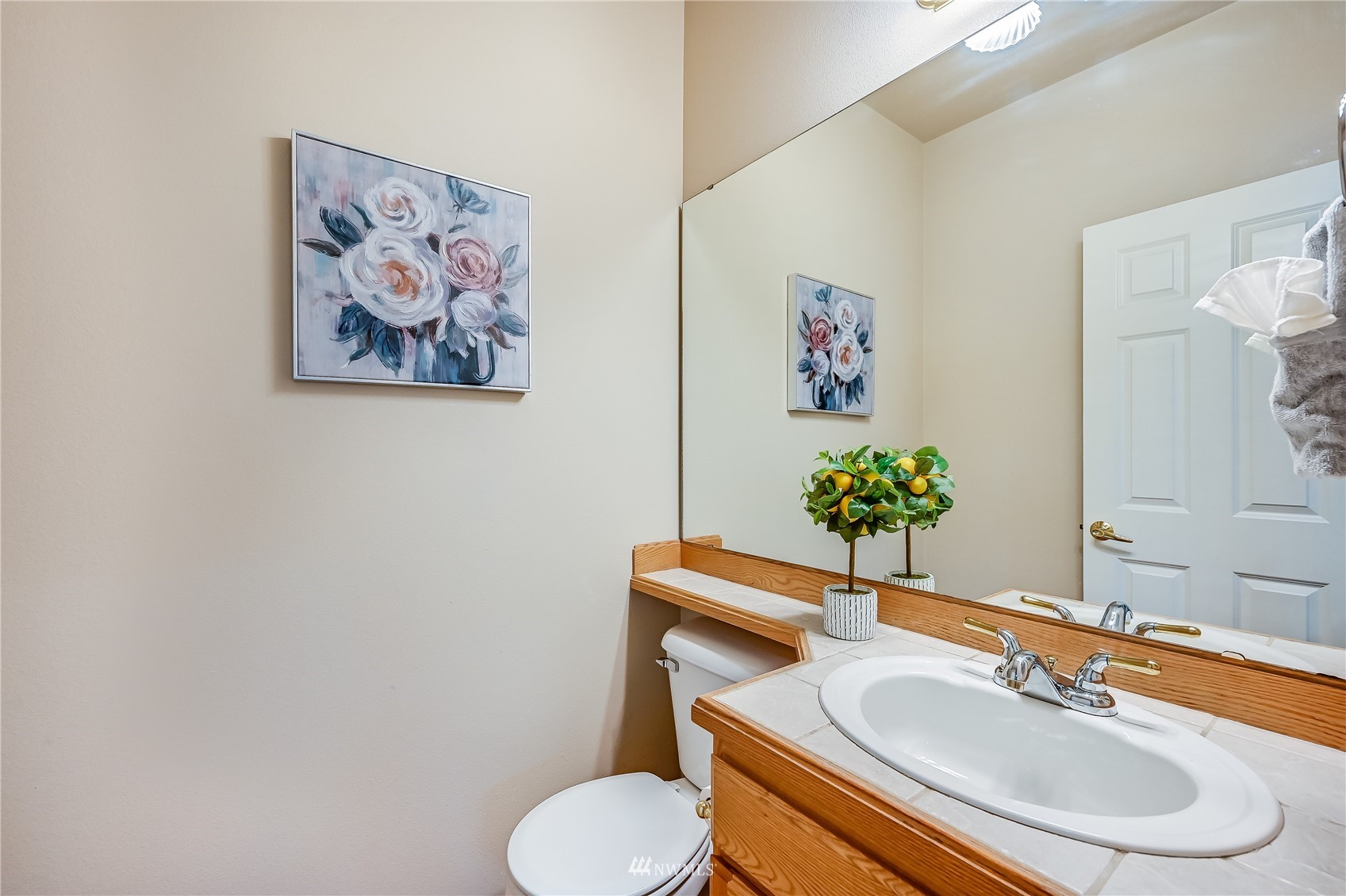 1125 185th Place Southeast Bothell, WA 98012 - Photo 19 of 23 a bathroom with a toilet sink and mirror