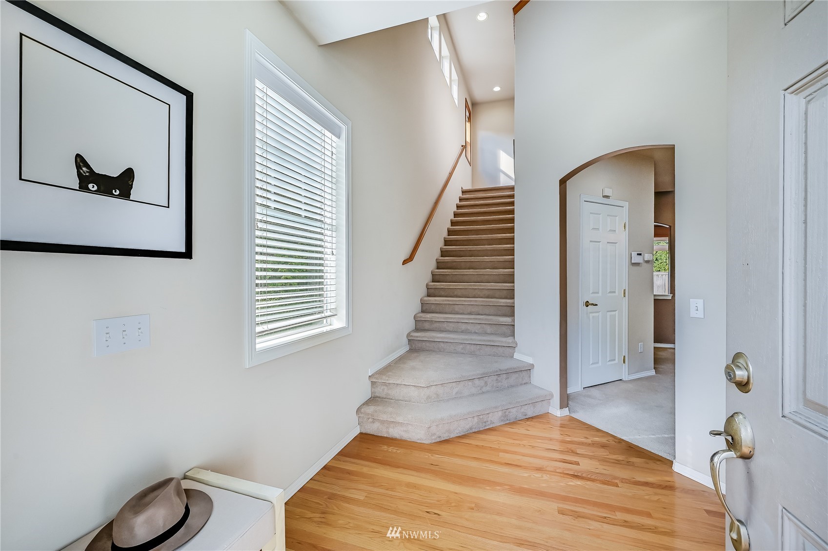 1125 185th Place Southeast Bothell, WA 98012 - Photo 2 of 23 a bedroom with a bed and a painting on the wall