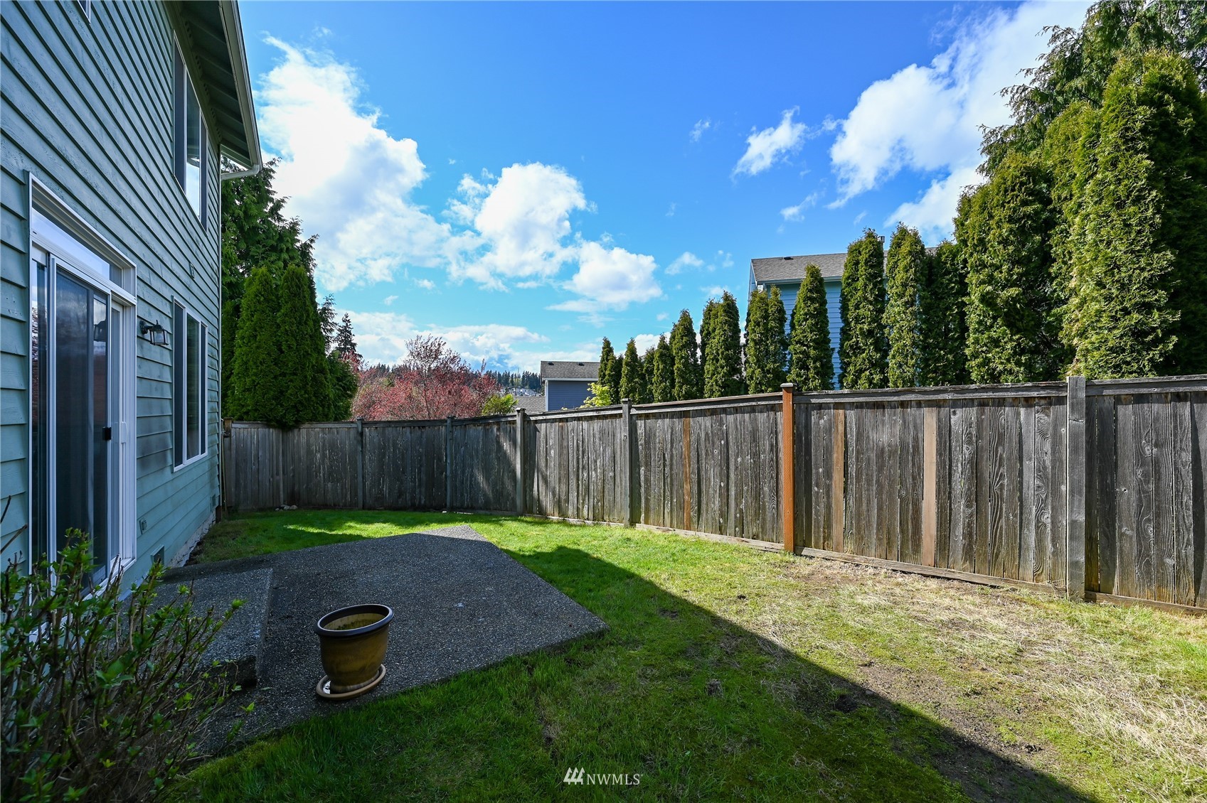 1125 185th Place Southeast Bothell, WA 98012 - Photo 22 of 23 a view of a backyard with wooden fence