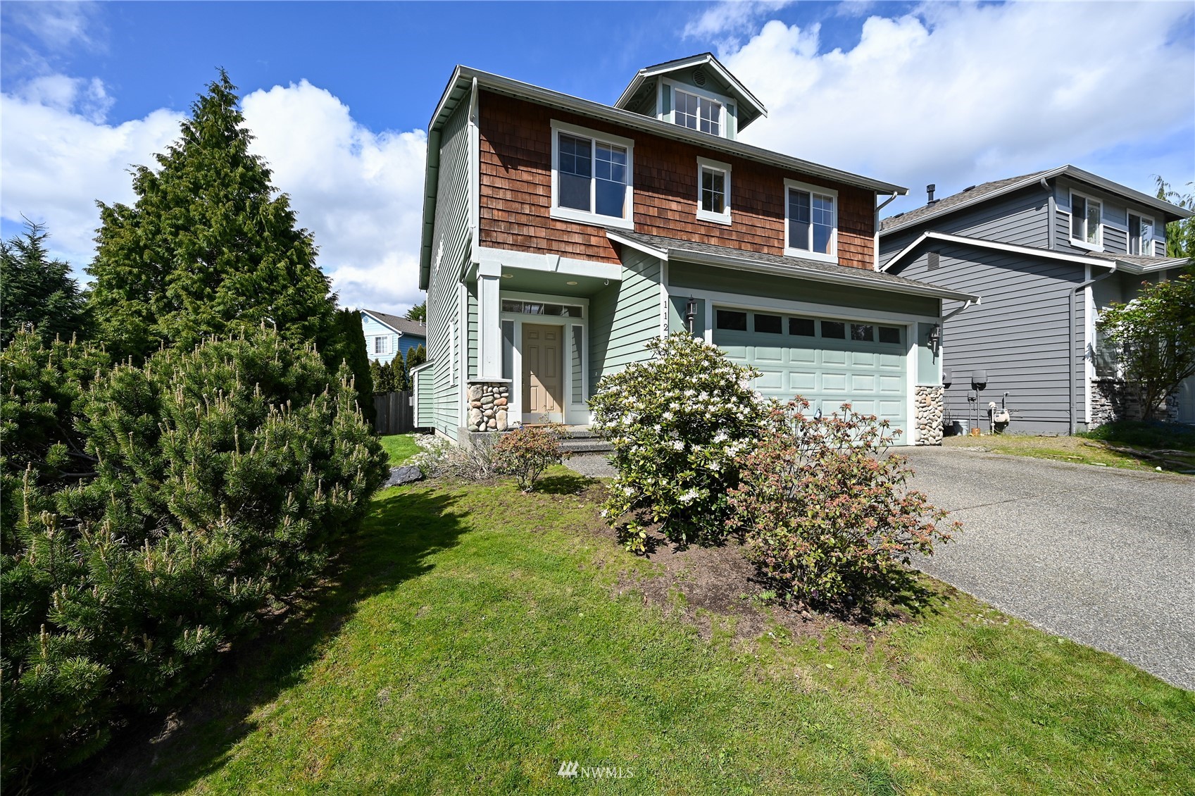 1125 185th Place Southeast Bothell, WA 98012 - Photo 23 of 23 a front view of a house with garden