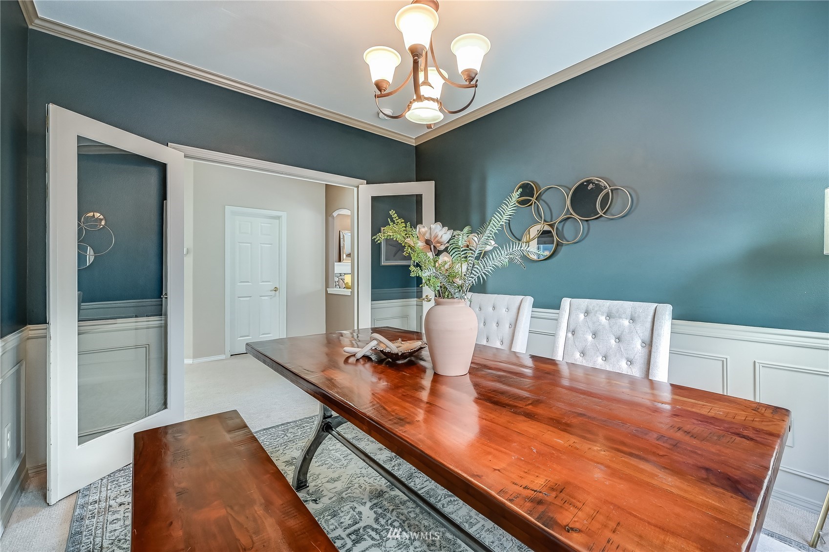 1125 185th Place Southeast Bothell, WA 98012 - Photo 4 of 23 a view of a dining room with furniture and chandelier