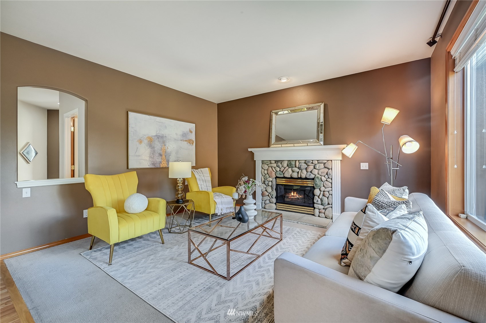 1125 185th Place Southeast Bothell, WA 98012 - Photo 5 of 23 a living room with furniture and a fireplace