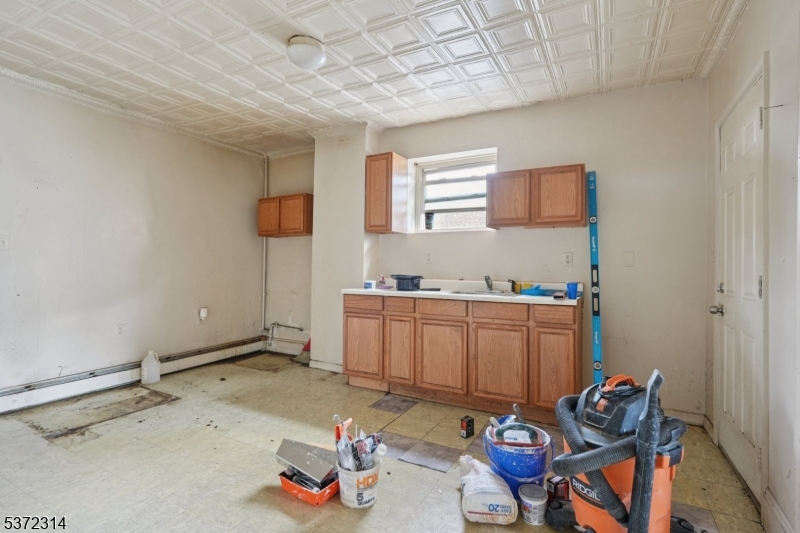 405 North 8th Street Prospect Park, NJ 07508 - Photo 18 of 34 a room with storage and utility