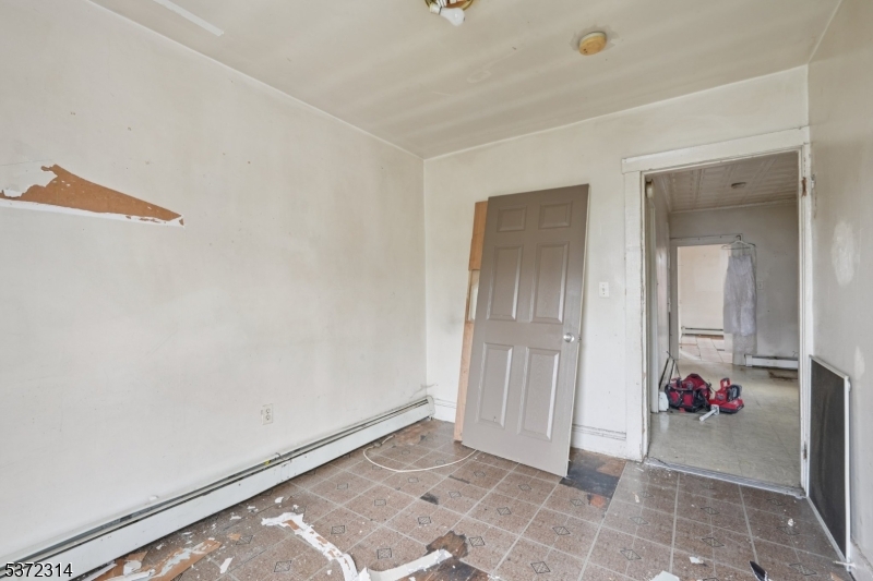 405 North 8th Street Prospect Park, NJ 07508 - Photo 20 of 34 a view of a livingroom with an empty space and a window