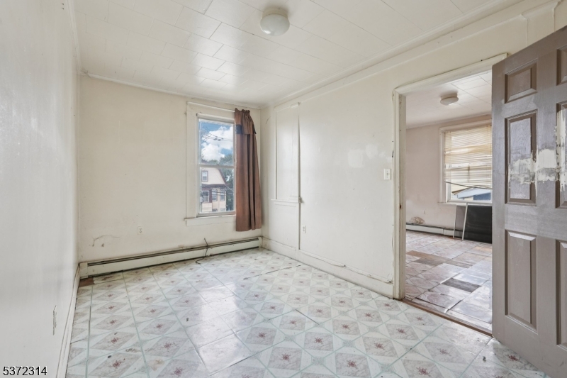 405 North 8th Street Prospect Park, NJ 07508 - Photo 26 of 34 a view of an empty room and window