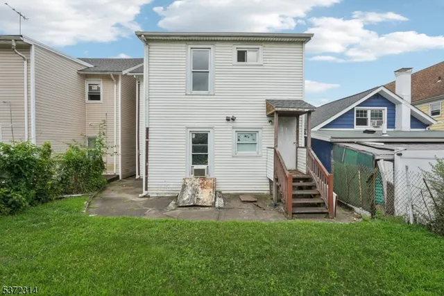 a view of a garden with wooden fence