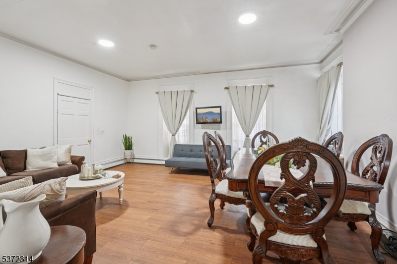 405 North 8th Street Prospect Park, NJ 07508 - Photo 6 of 34 a living room with furniture a rug and a window