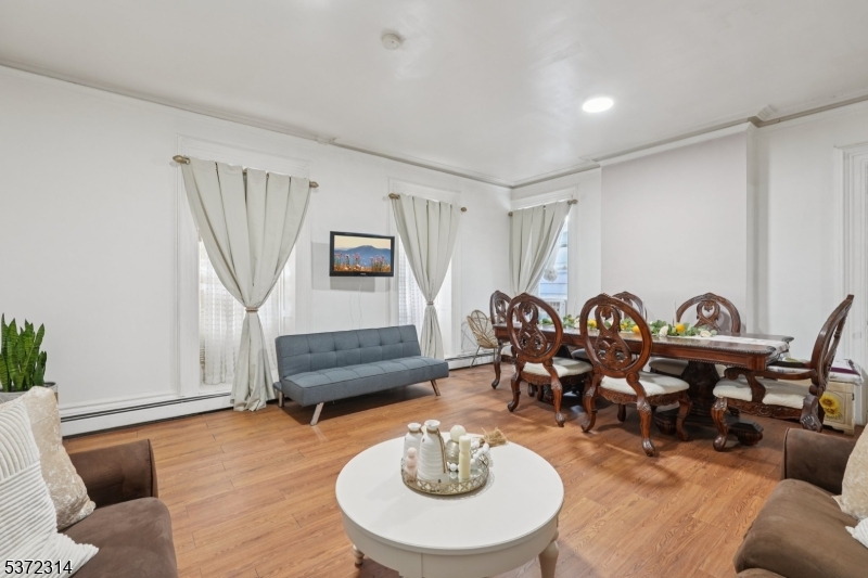405 North 8th Street Prospect Park, NJ 07508 - Photo 8 of 34 a living room with furniture a rug and a window