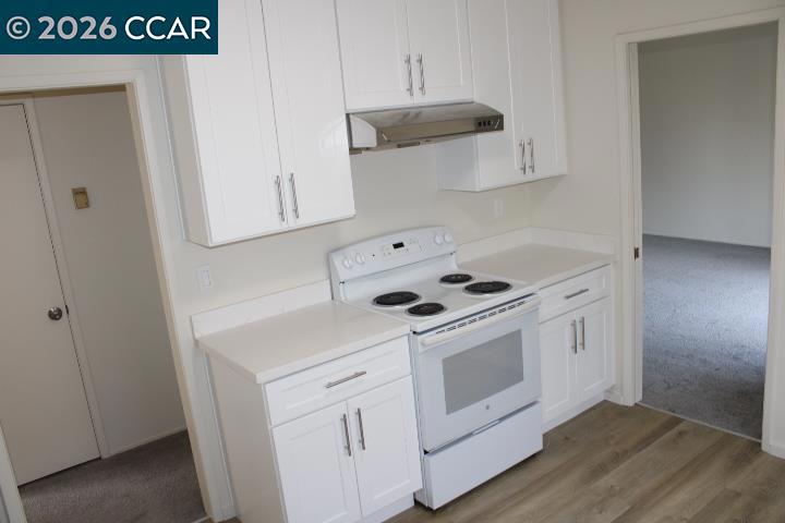 615 Lexington Avenue El Cerrito, CA 94530 - Photo 7 of 19 a white stove top oven sitting inside of a kitchen