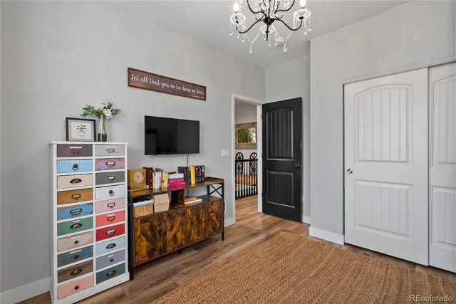 a view of a livingroom with furniture and wooden floor