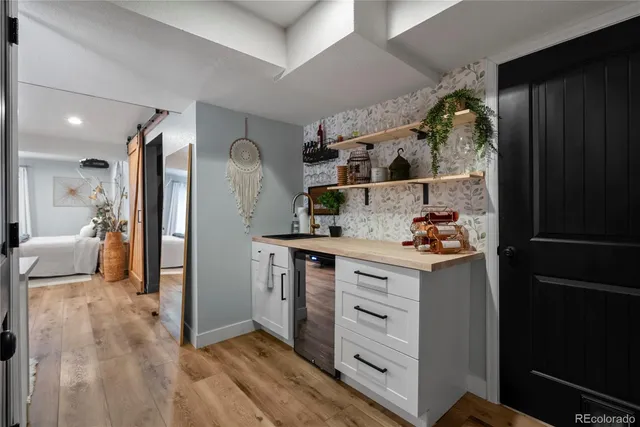 a kitchen with stainless steel appliances a refrigerator and cabinets