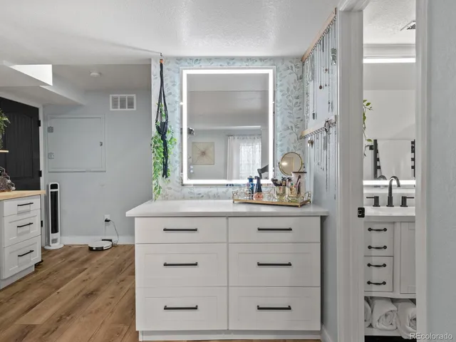 a bathroom with cabinets and window