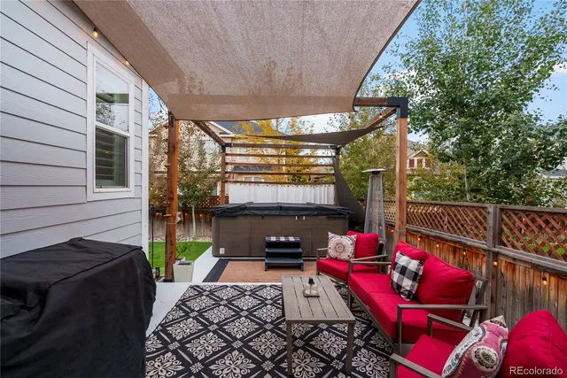 a patio with table and chairs