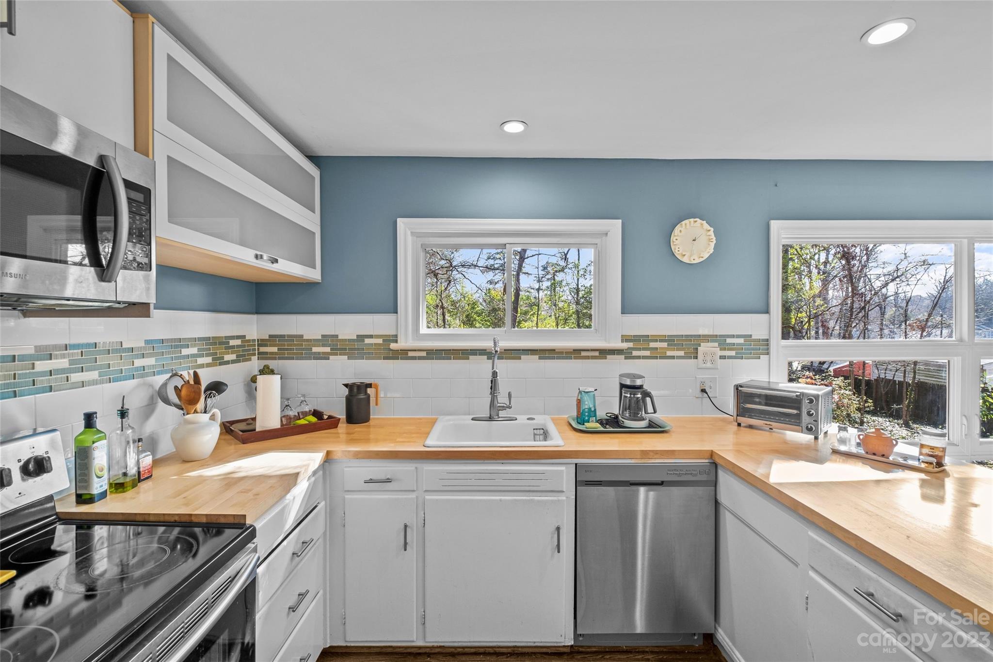 4439 Applegate Road Charlotte, NC 28209 - Photo 12 of 34 a kitchen with a sink cabinets and window