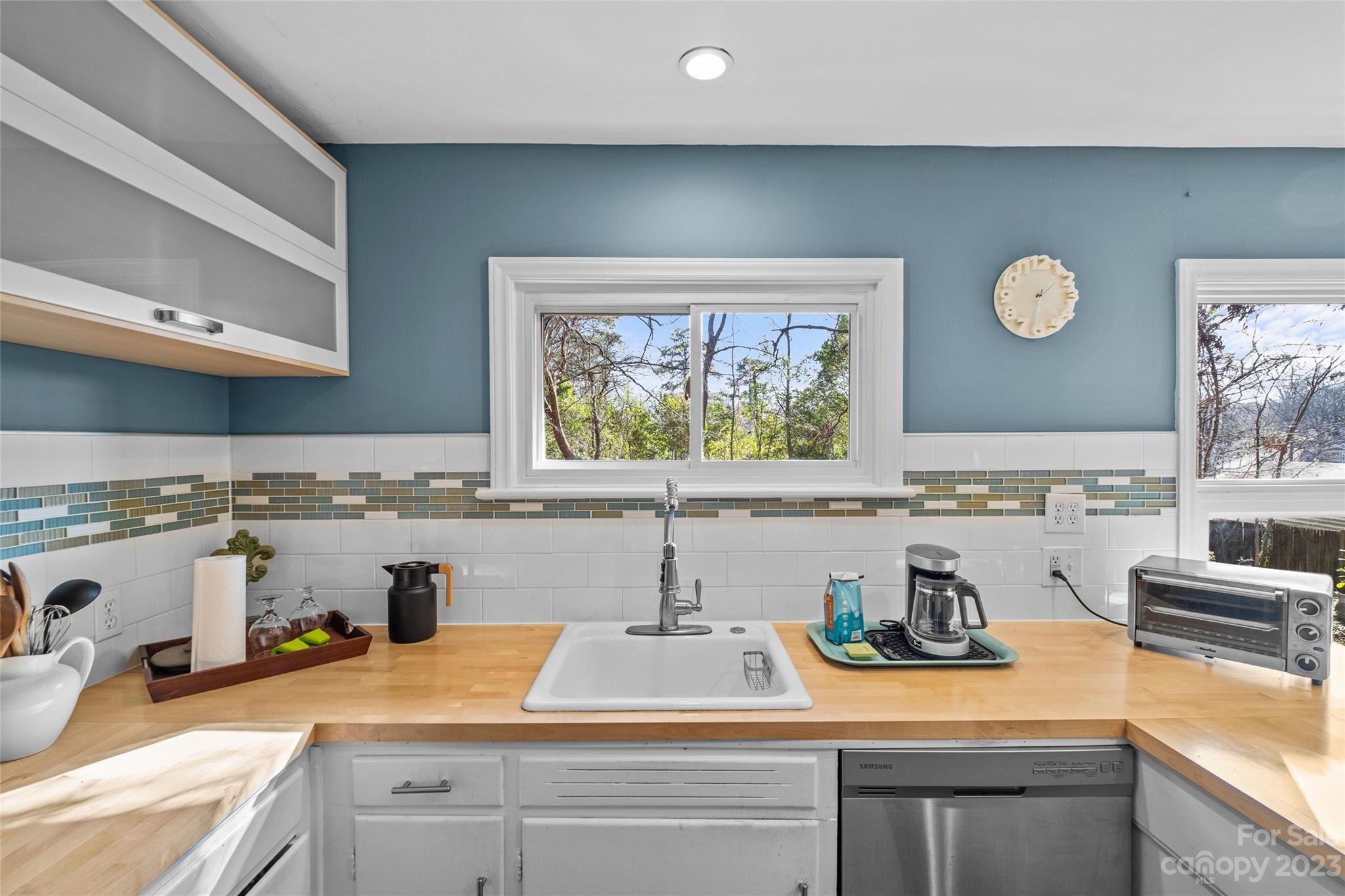4439 Applegate Road Charlotte, NC 28209 - Photo 13 of 34 a kitchen with a sink and a stove top oven