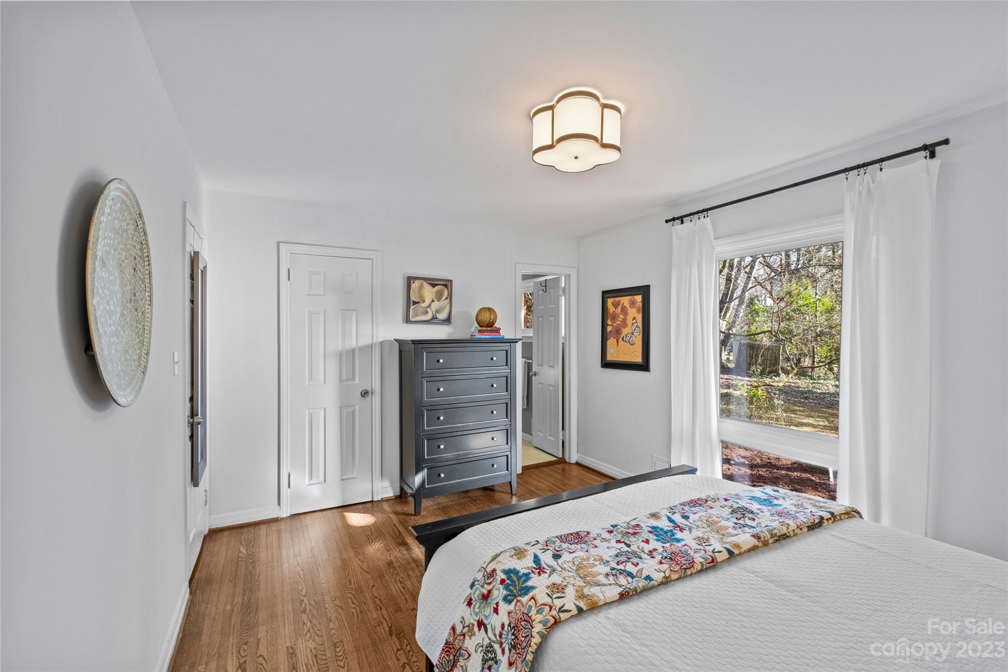 4439 Applegate Road Charlotte, NC 28209 - Photo 16 of 34 a bedroom with a bed and a window