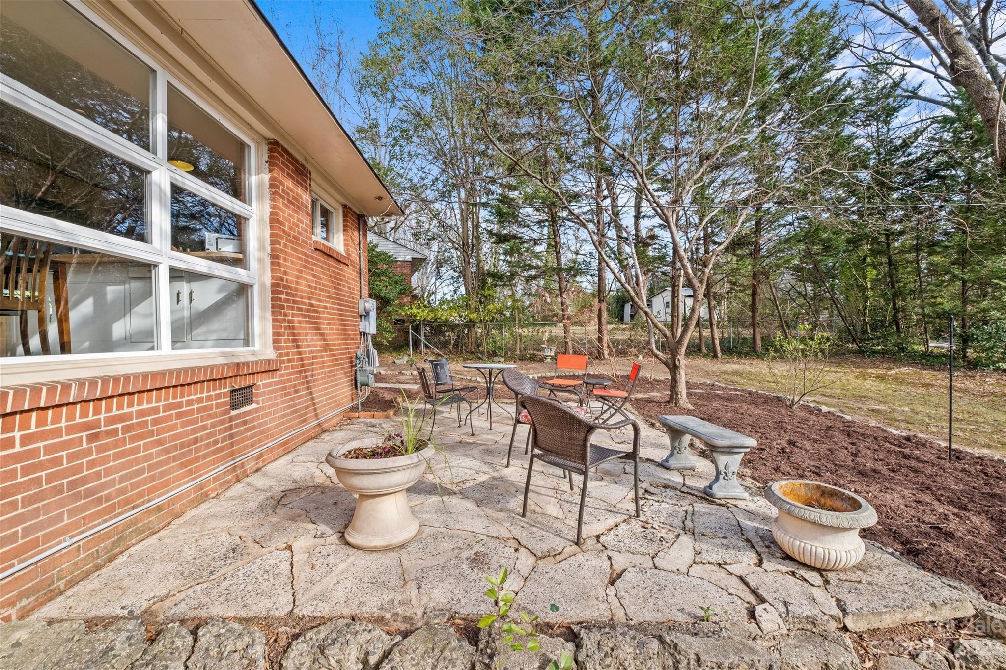 4439 Applegate Road Charlotte, NC 28209 - Photo 22 of 34 a view of a backyard with sitting area