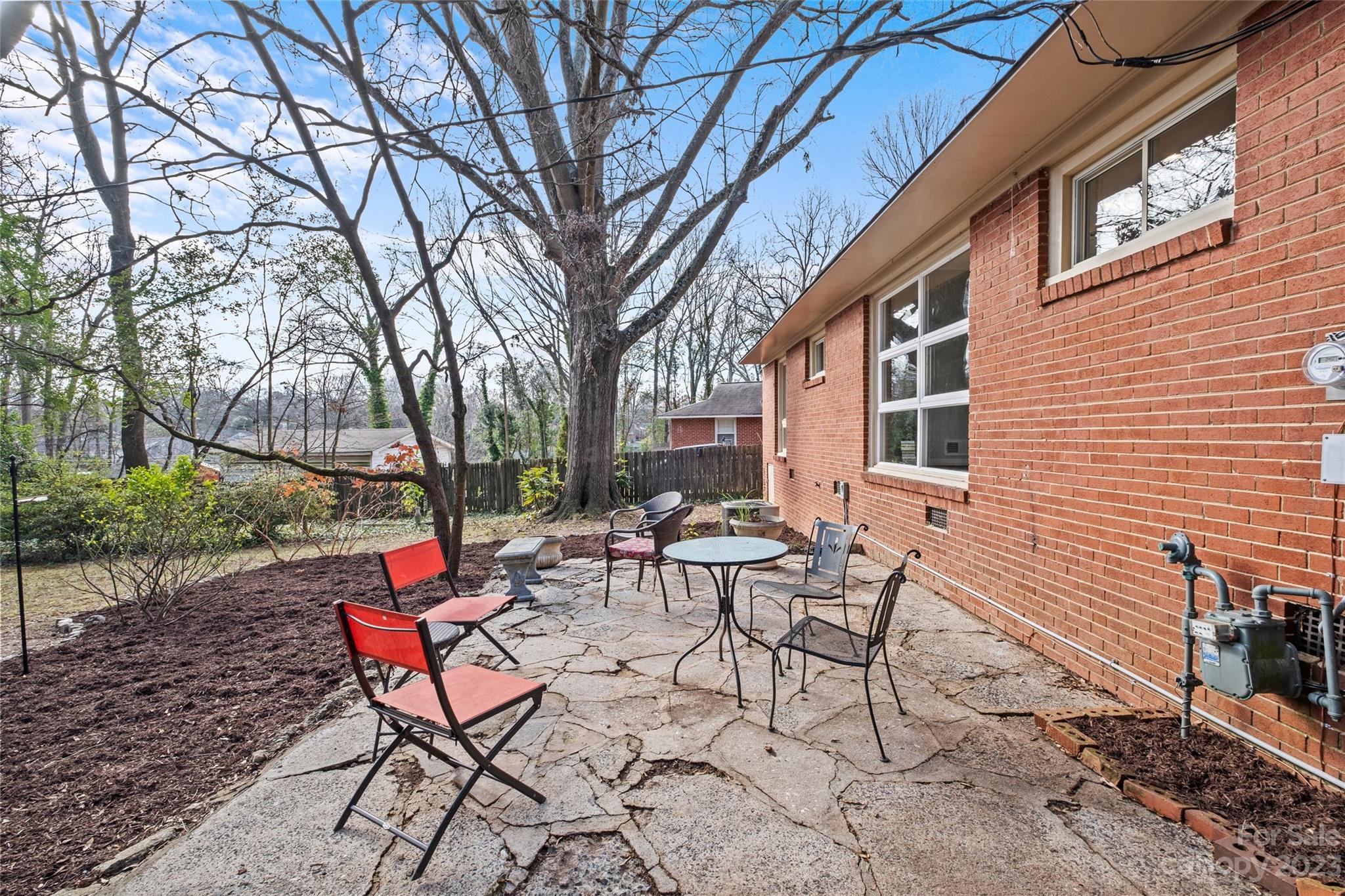 4439 Applegate Road Charlotte, NC 28209 - Photo 23 of 34 a view of a patio with a table and chairs and a barbeque