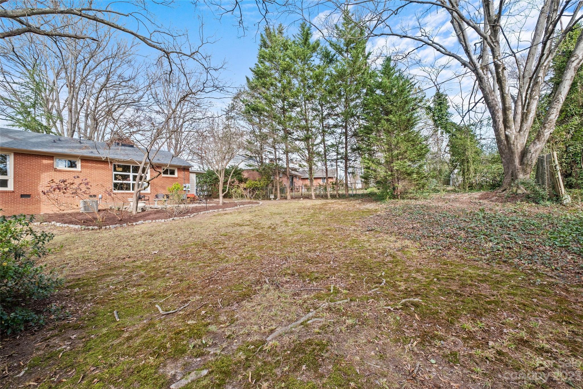 4439 Applegate Road Charlotte, NC 28209 - Photo 27 of 34 a backyard of apartments with large trees