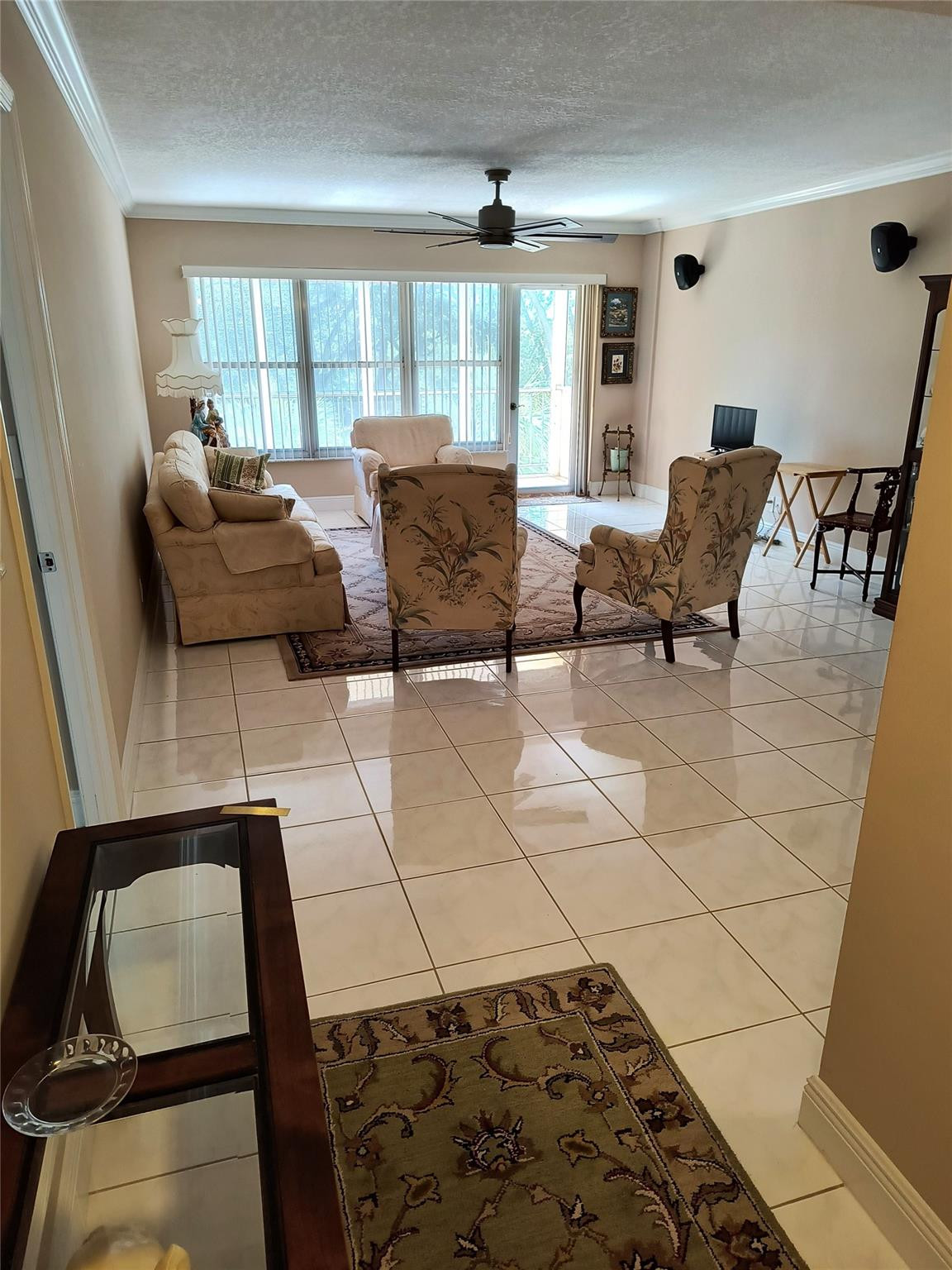 10777 West Sample Road, Unit 402 Coral Springs, FL 33065 - Photo 15 of 27 a living room with furniture and a window
