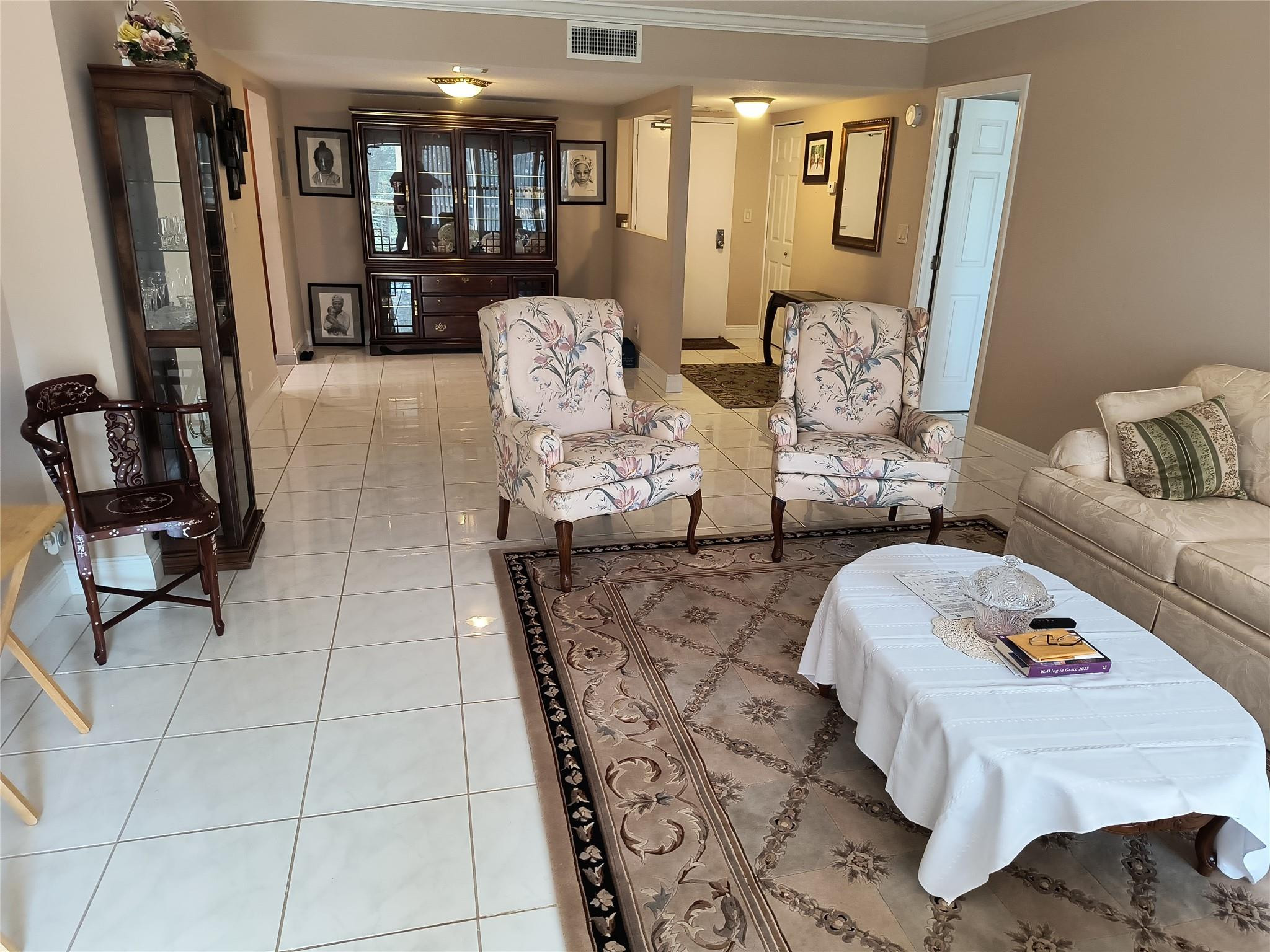 10777 West Sample Road, Unit 402 Coral Springs, FL 33065 - Photo 23 of 27 a living room with furniture