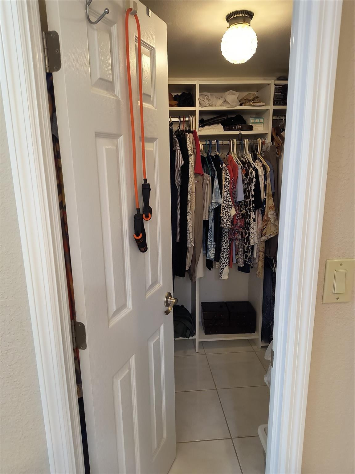 10777 West Sample Road, Unit 402 Coral Springs, FL 33065 - Photo 27 of 27 a view of walk in closet with clothes and shoes