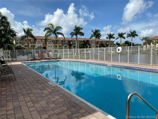 a view of a swimming pool with a lake view