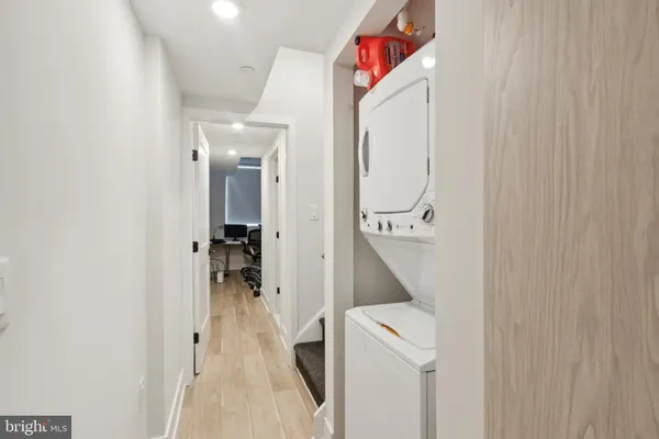 a view of a hallway with two white painted walls