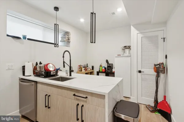 a kitchen with a sink and cabinets