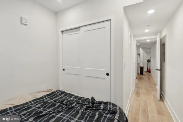 a bedroom with a bed and a view of bedroom